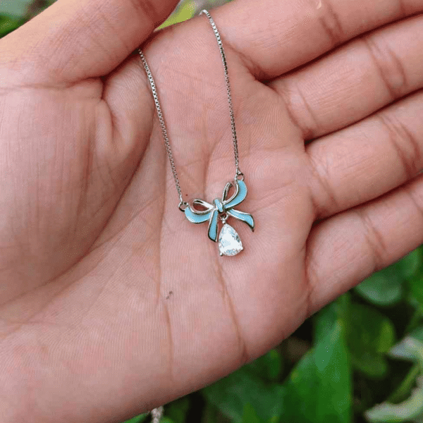 BOW WITH TEARDROP CHAIN PENDANT